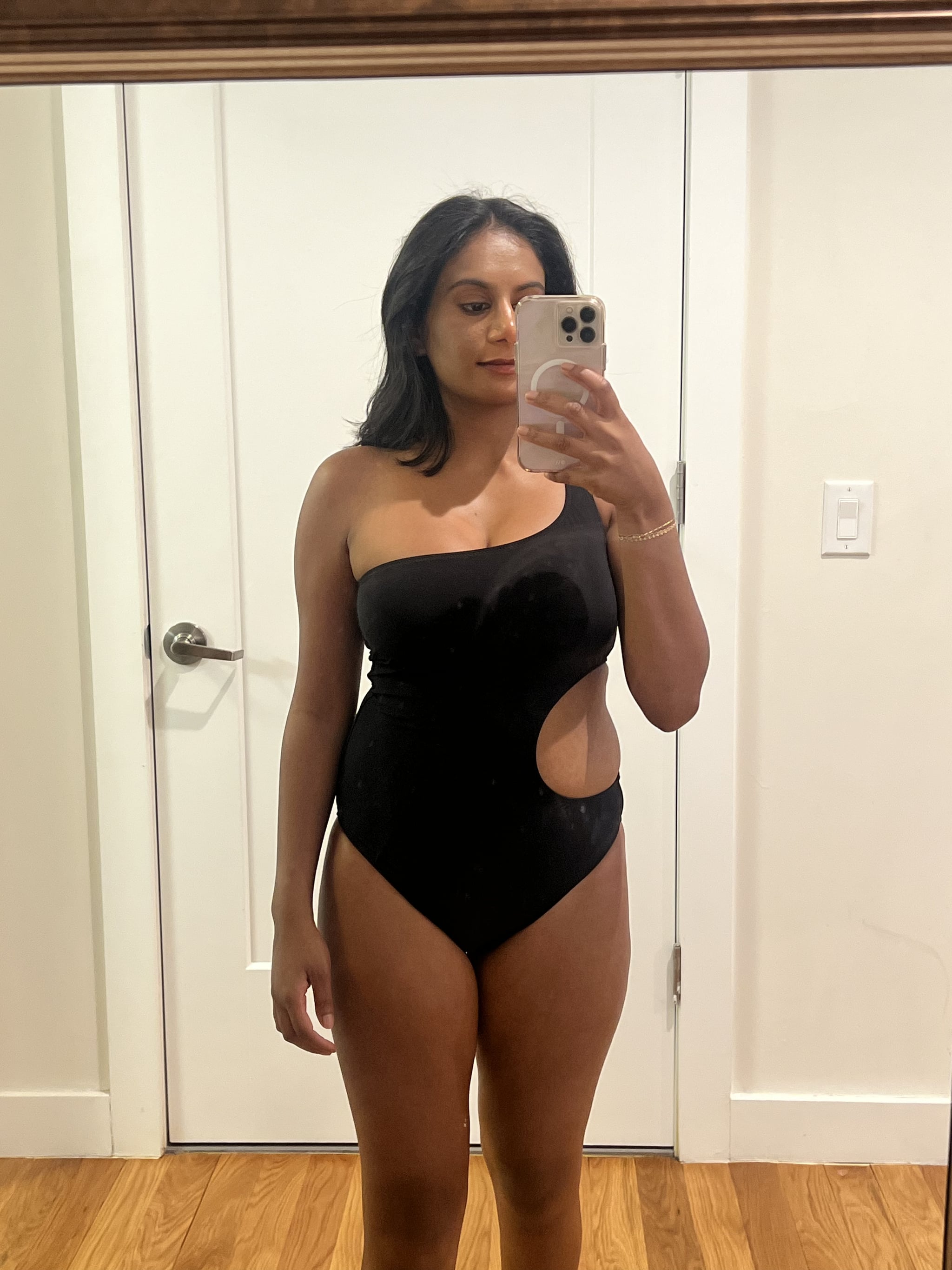 Woman wearing the Araks The Juliette One Piece in black.