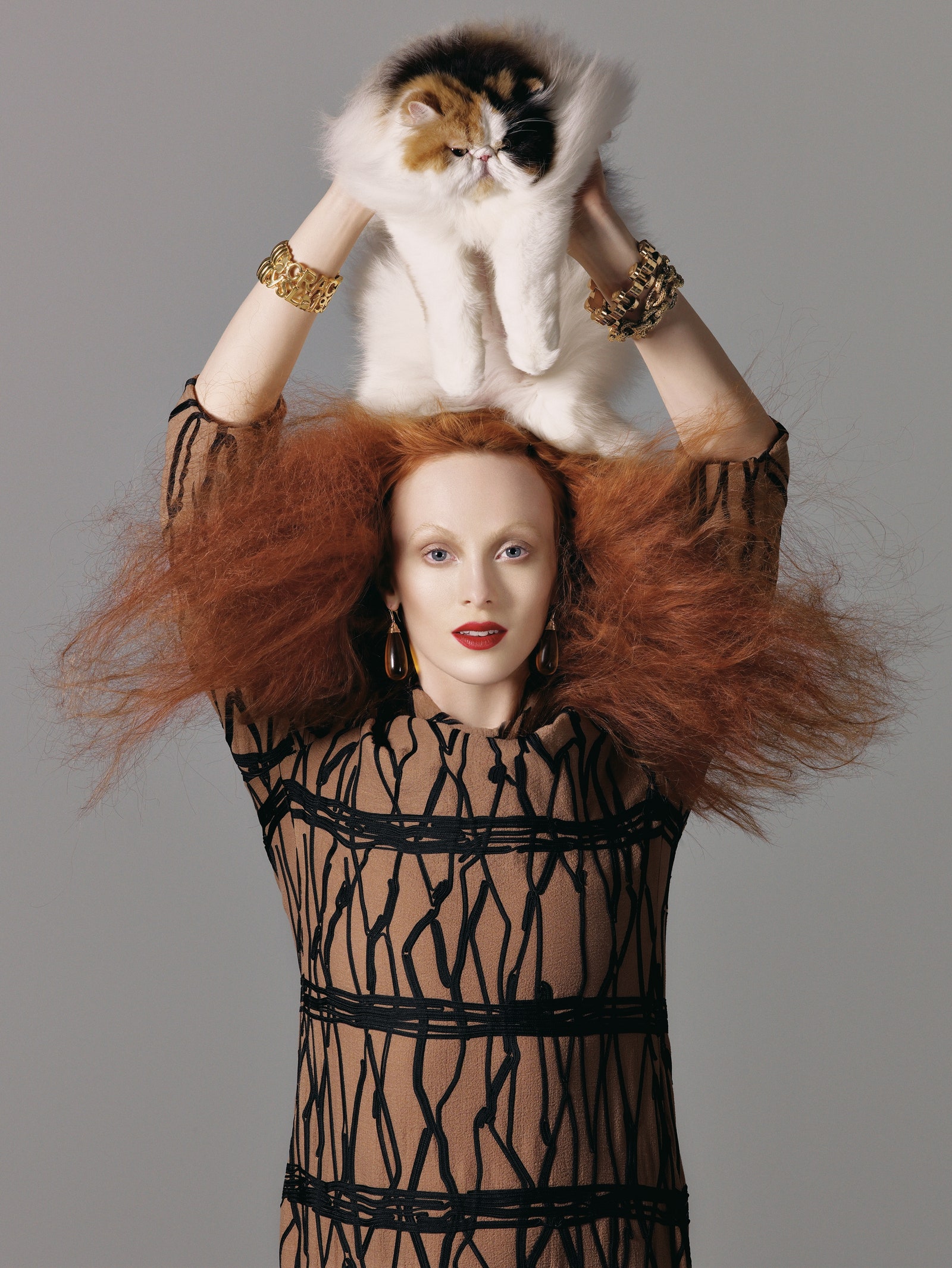 Image may contain Karen Elson Face Head Person Photography Portrait Clothing Dress Animal Cat Mammal and Pet