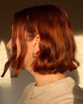 Woman wearing diamond jewelry.