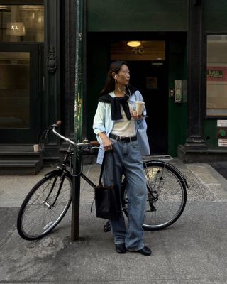 Influencer wearing button down shirt outfit.