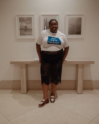 @abimarvel wearing two-tone loafers and a lace skirt with t-shirt