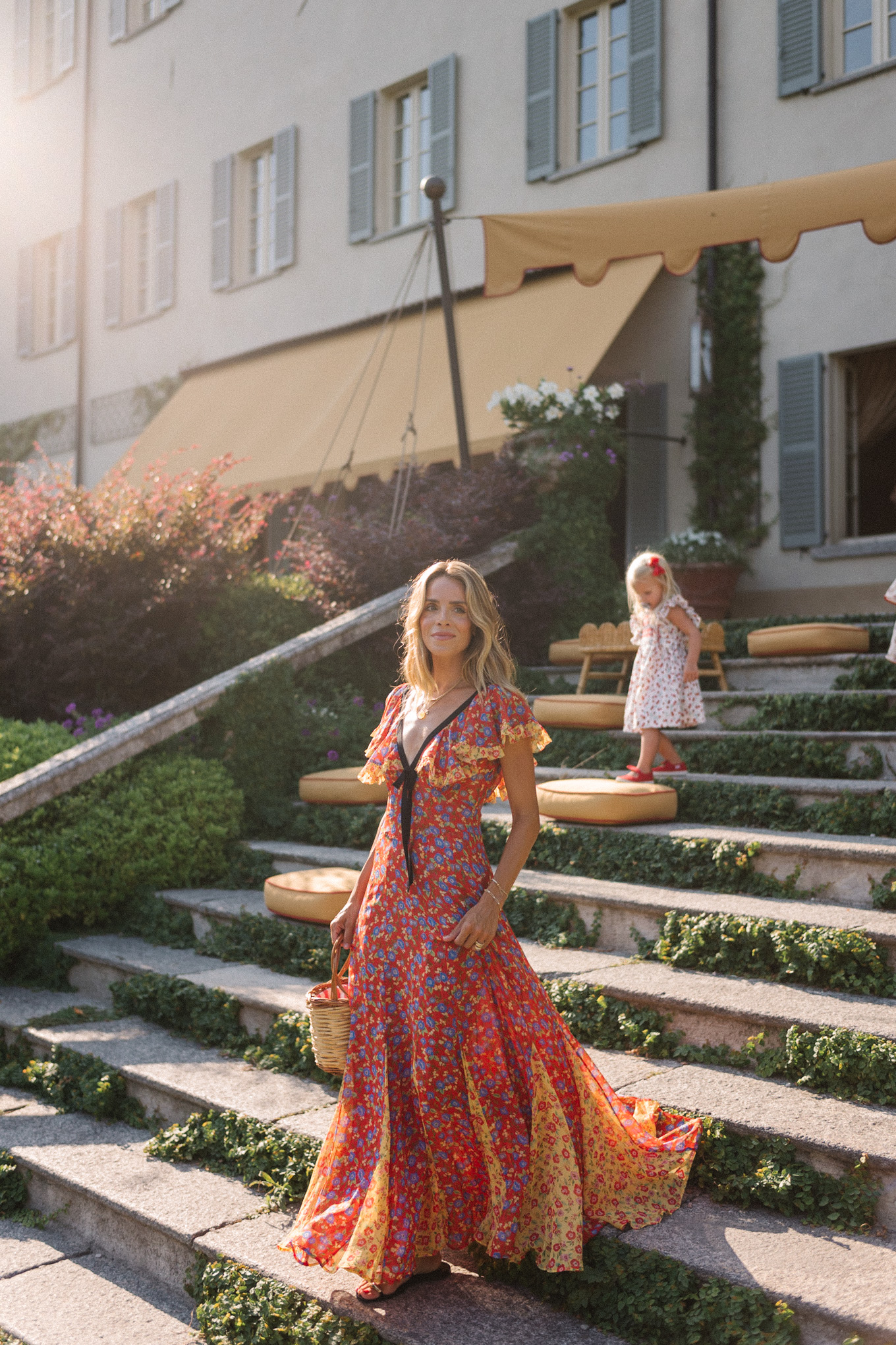 lake como italy red yellow blue floral dress