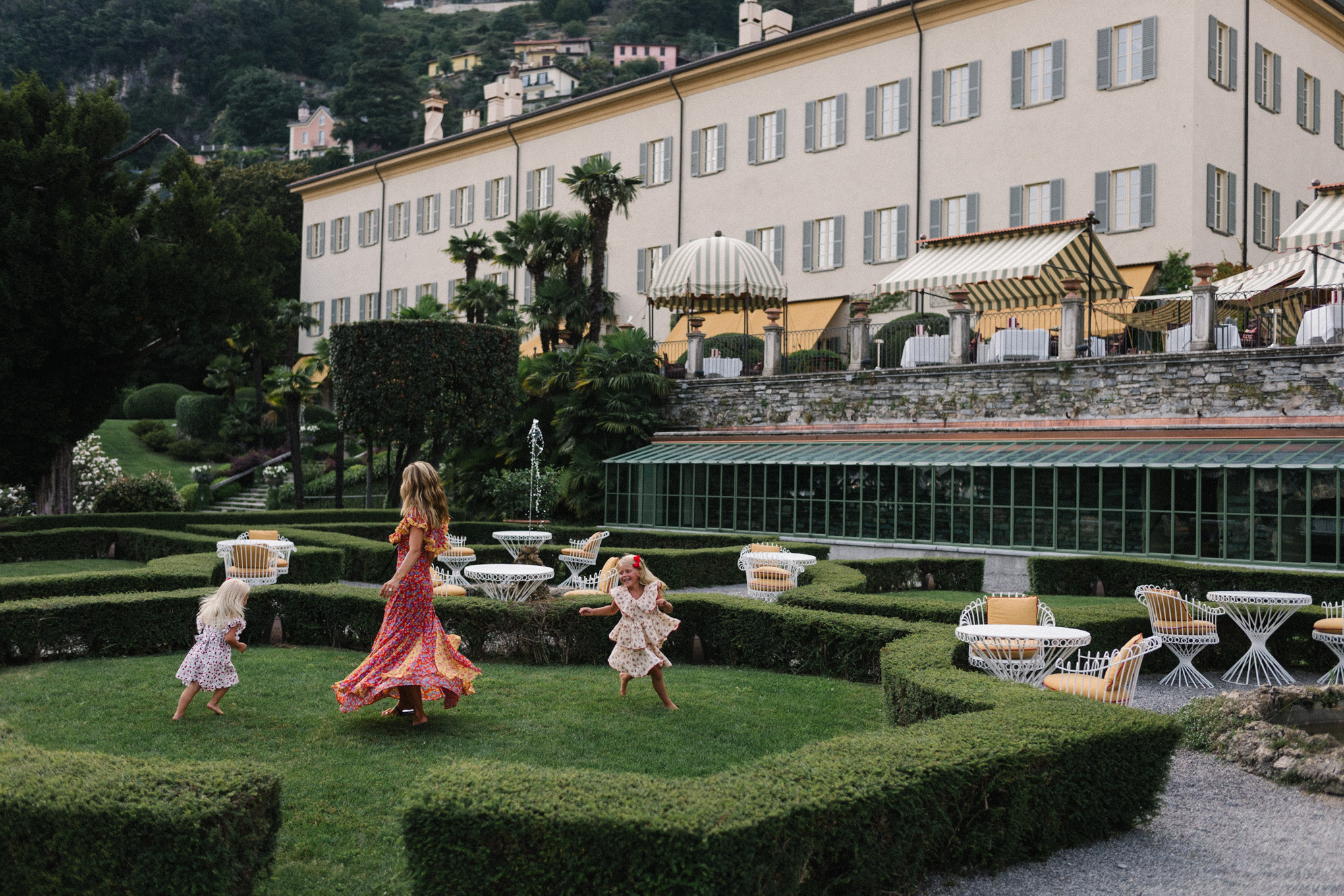 lake como italy red yellow blue floral dress