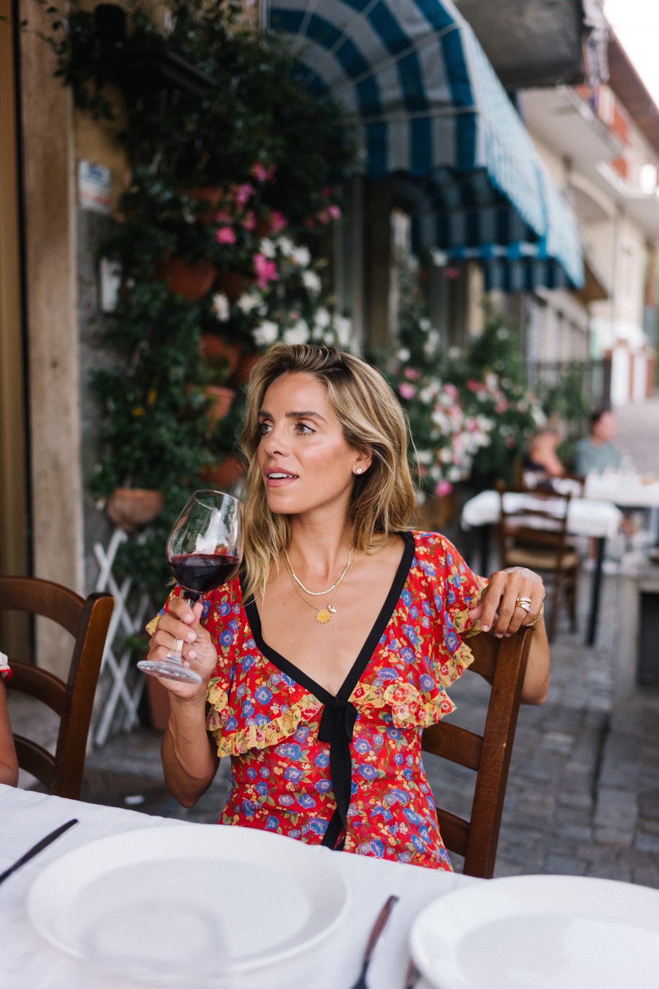 lake como italy red yellow blue floral dress