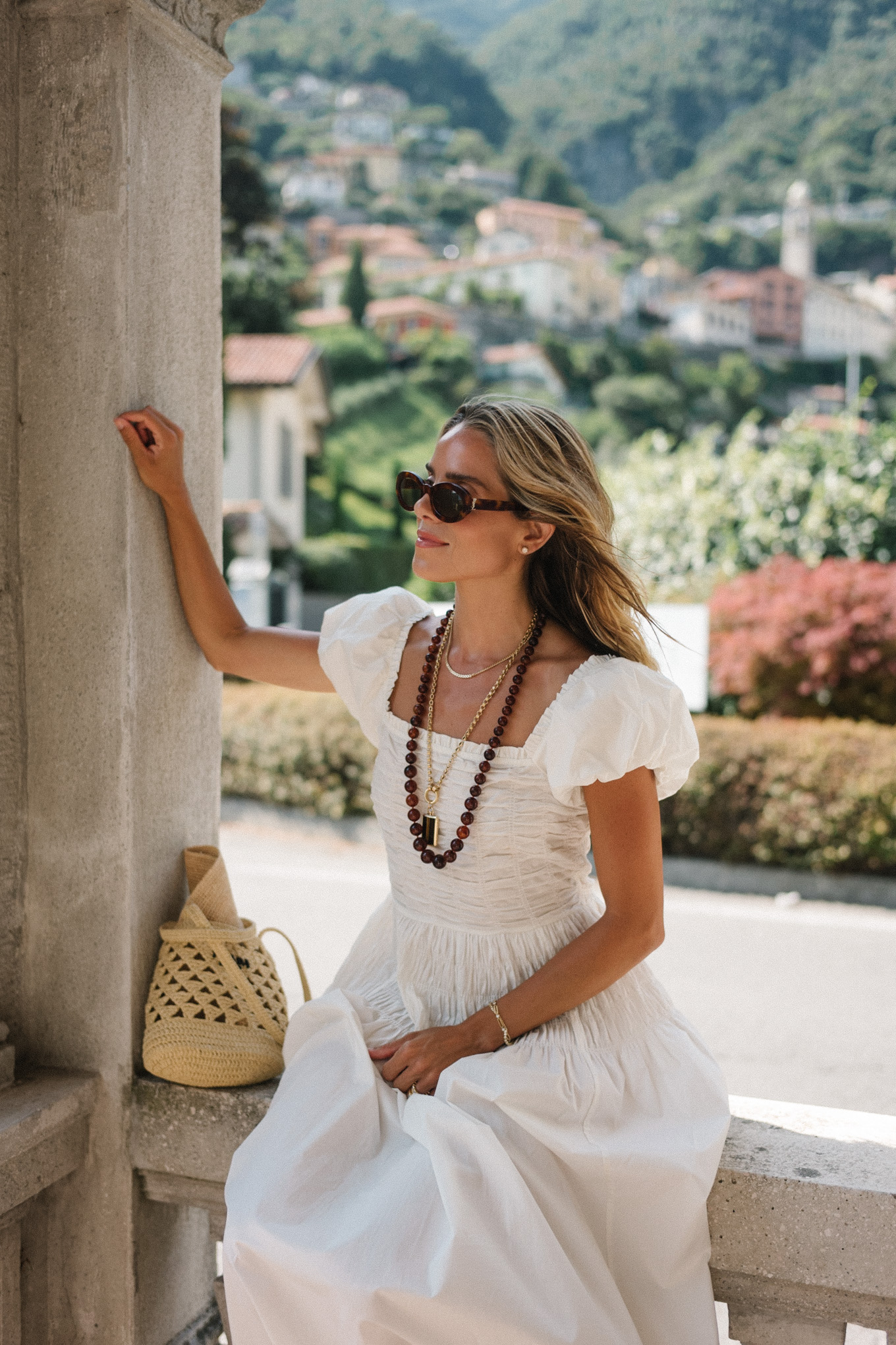 white cotton puff sleeve maxi dress brown beaded necklace