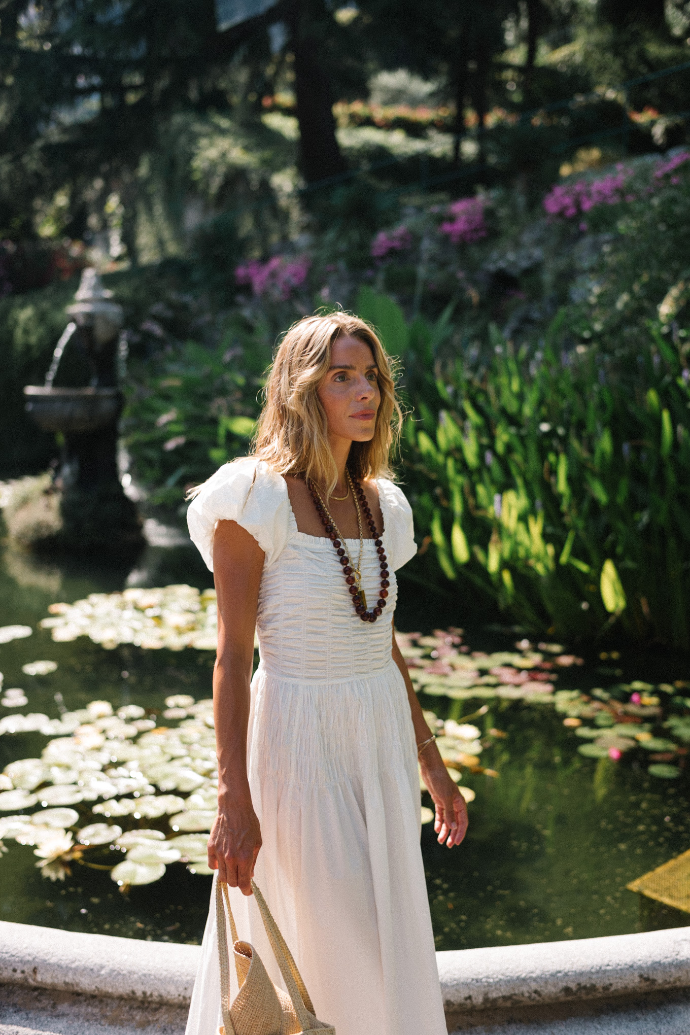 white cotton puff sleeve maxi dress brown beaded necklace