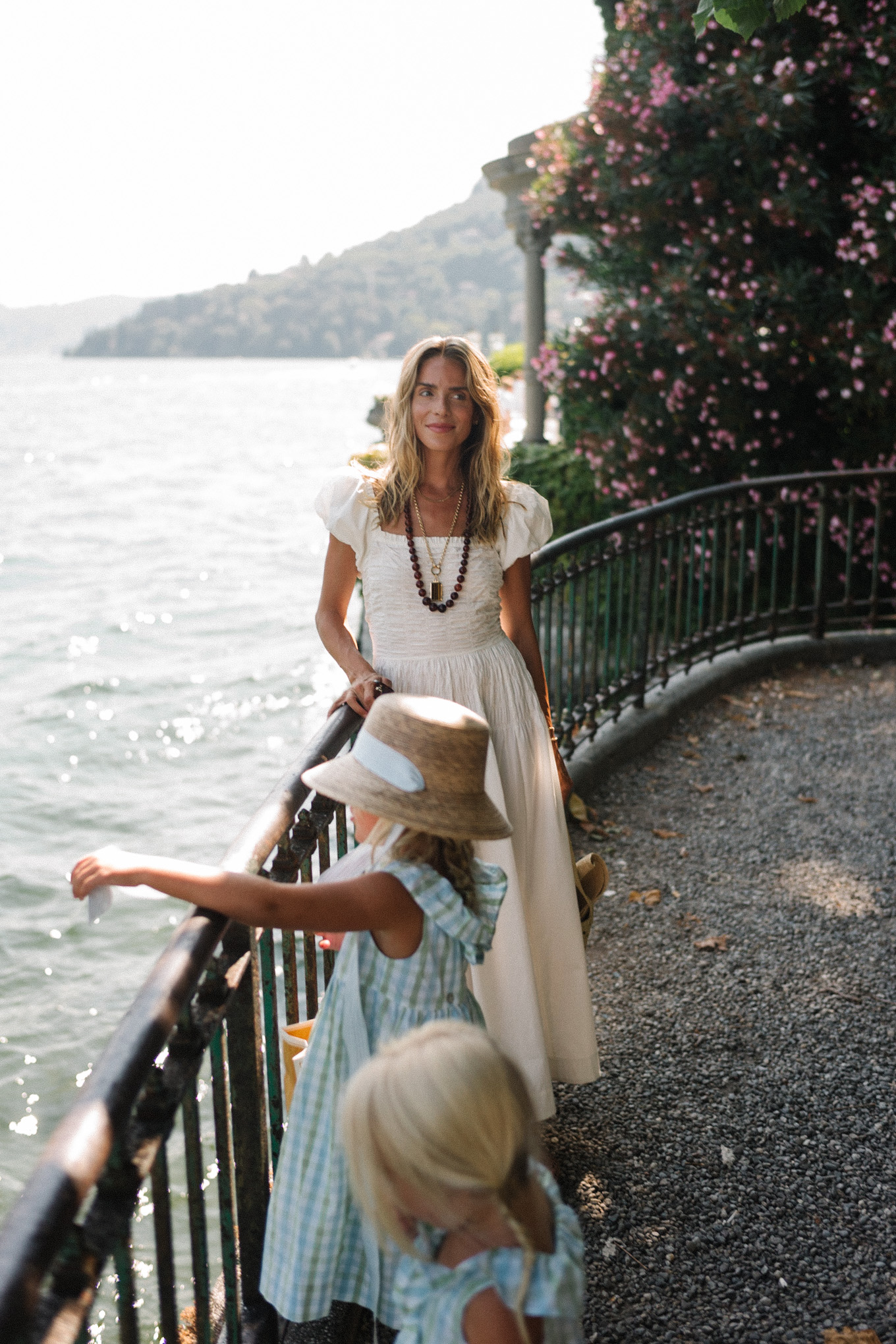 white cotton puff sleeve maxi dress brown beaded necklace