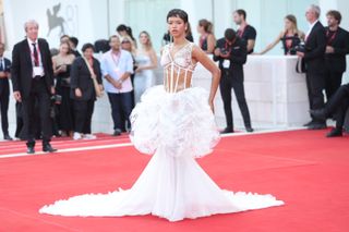 Taylor Russell wears a vintage white Chanel dress to the 2024 Venice Film Festival