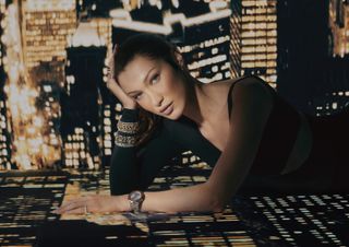 Bella Hadid poses wearing gold and silver jewelry in a Chopard campaign