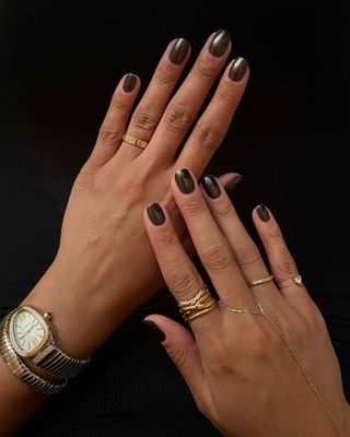 A brown chrome manicure by Iram Shelton