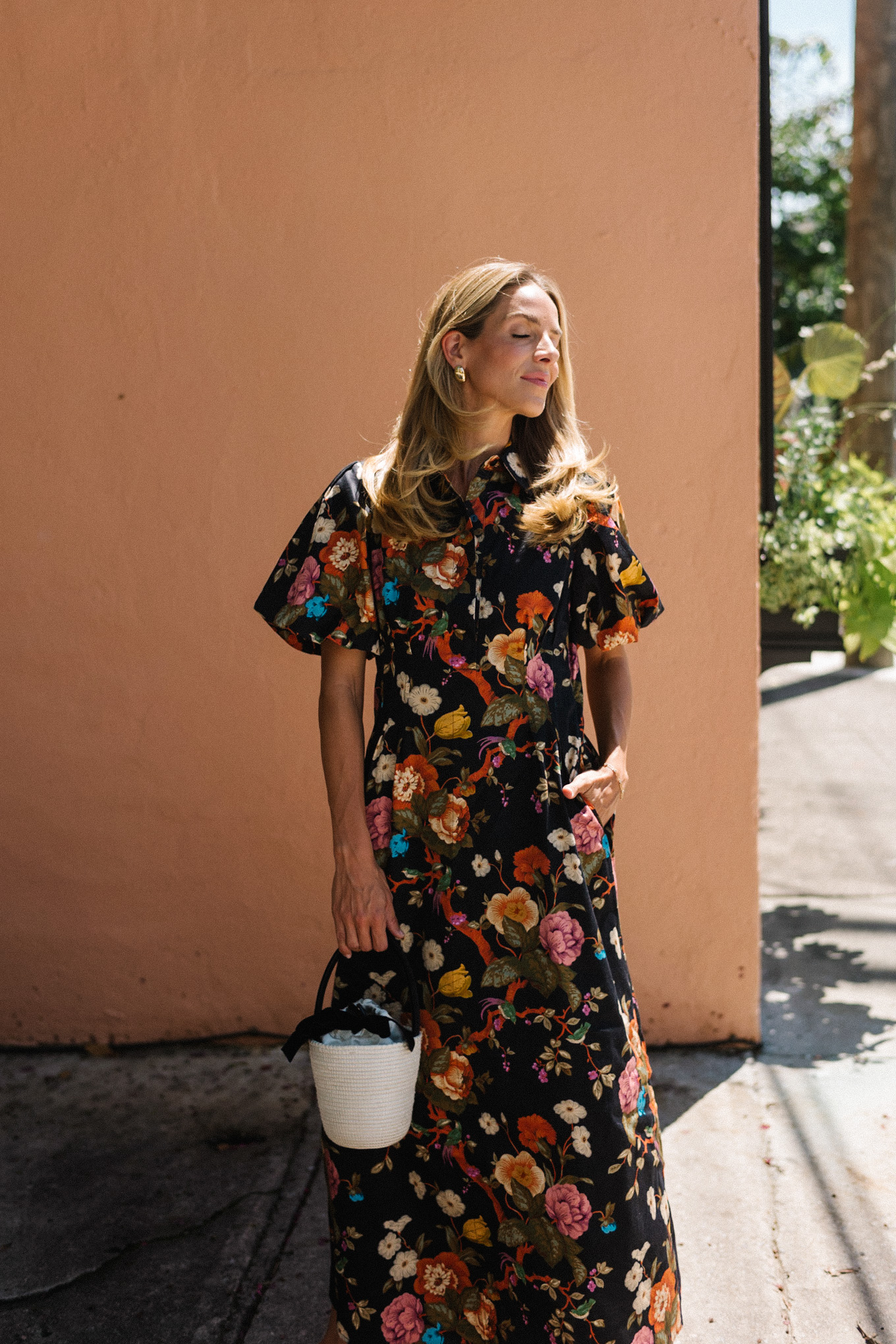 black floral puff sleeve maxi dress raffia bucket bag