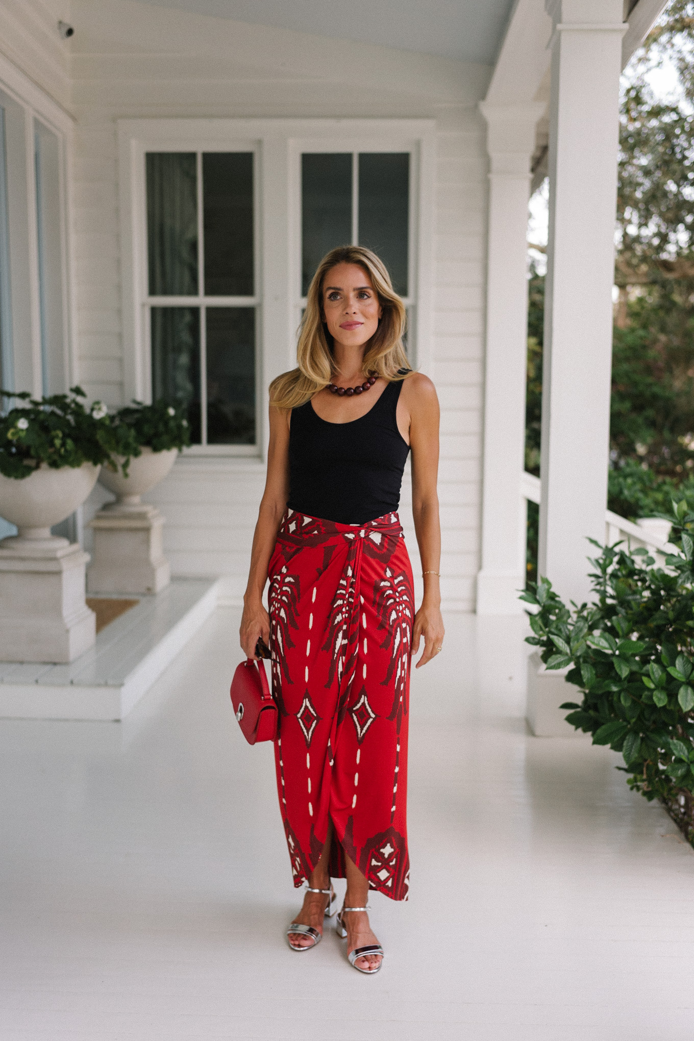 black tank red maxi wrap skirt silver heels red bag