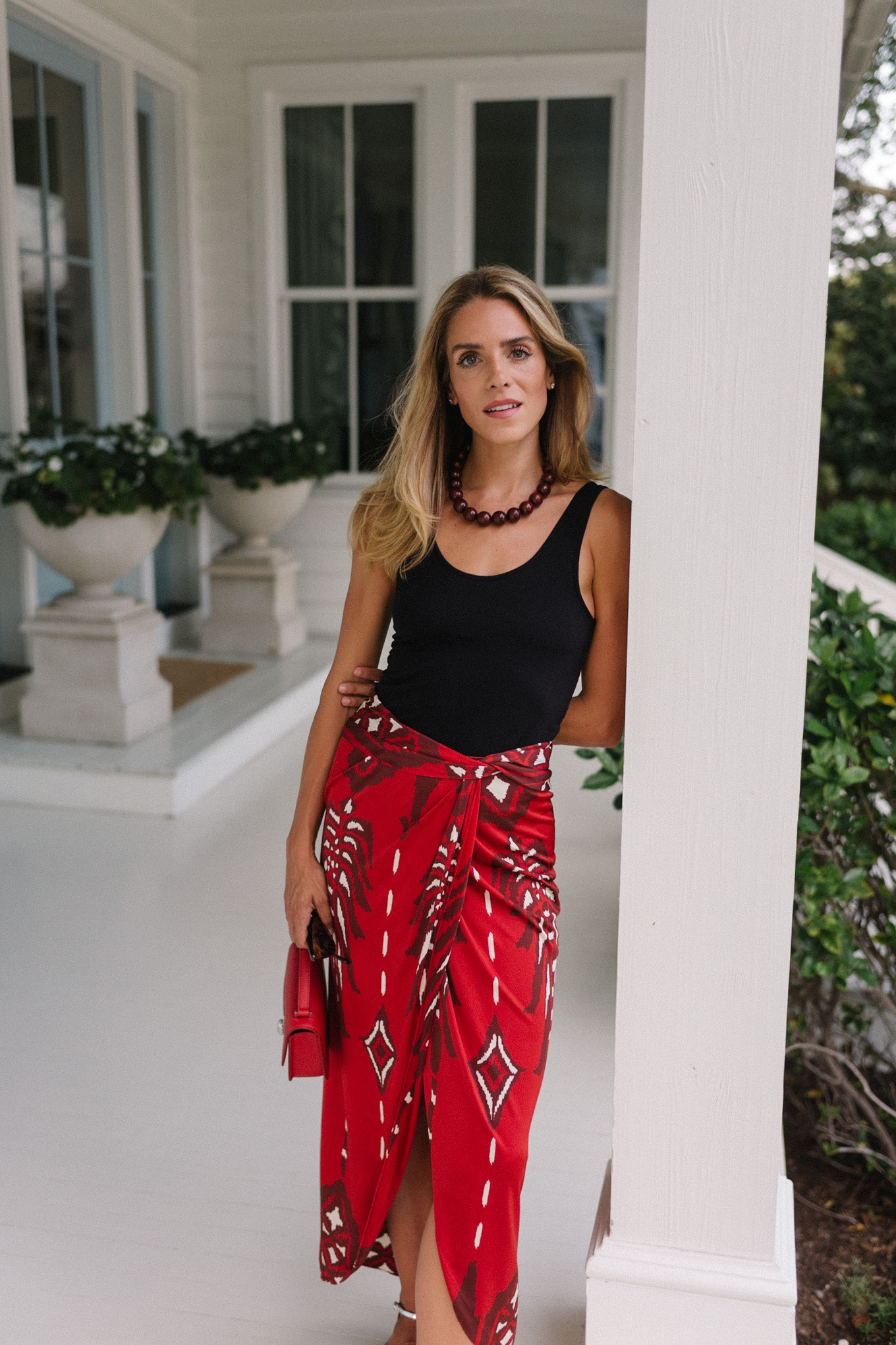 black tank red maxi wrap skirt silver heels red bag