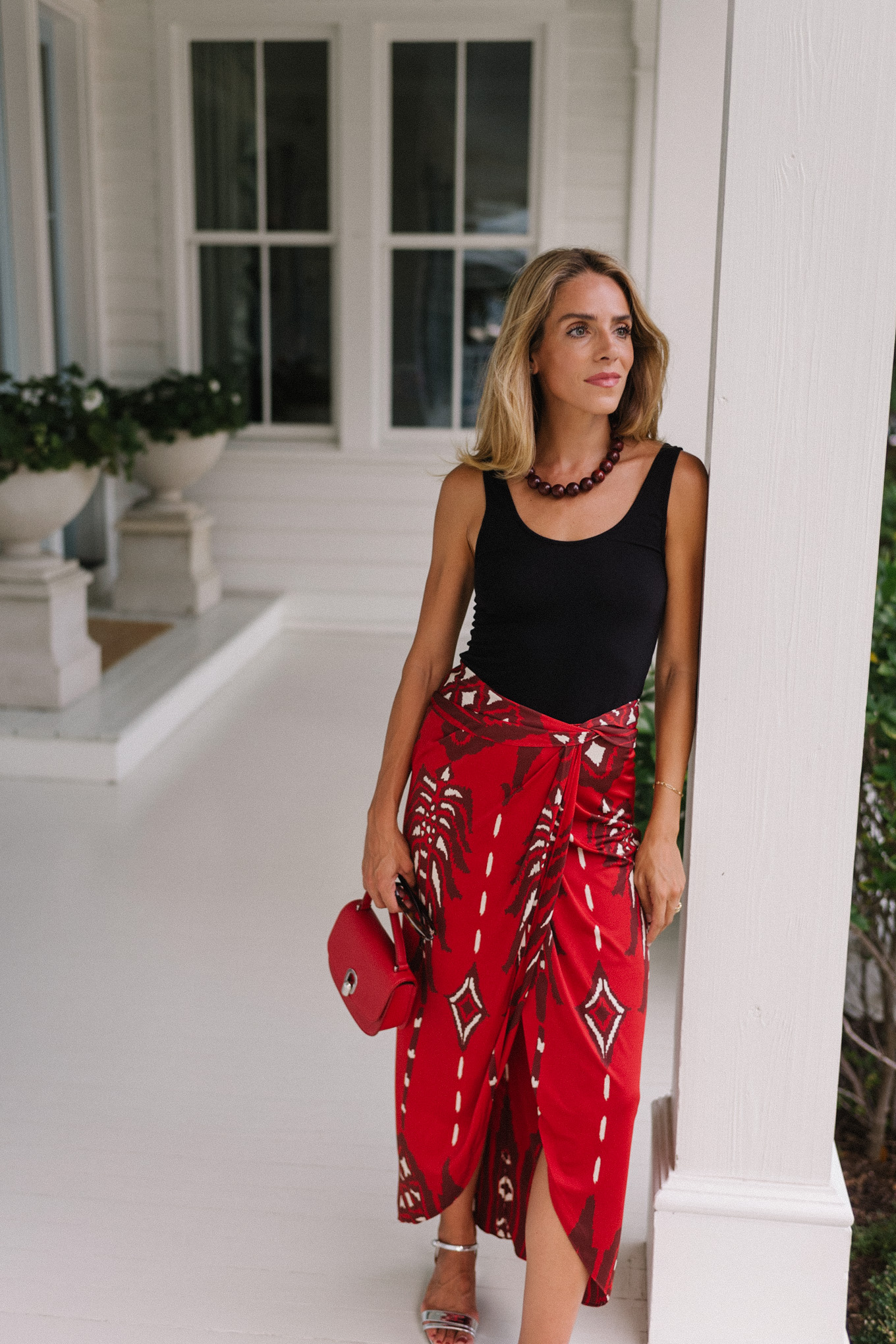 black tank red maxi wrap skirt silver heels red bag