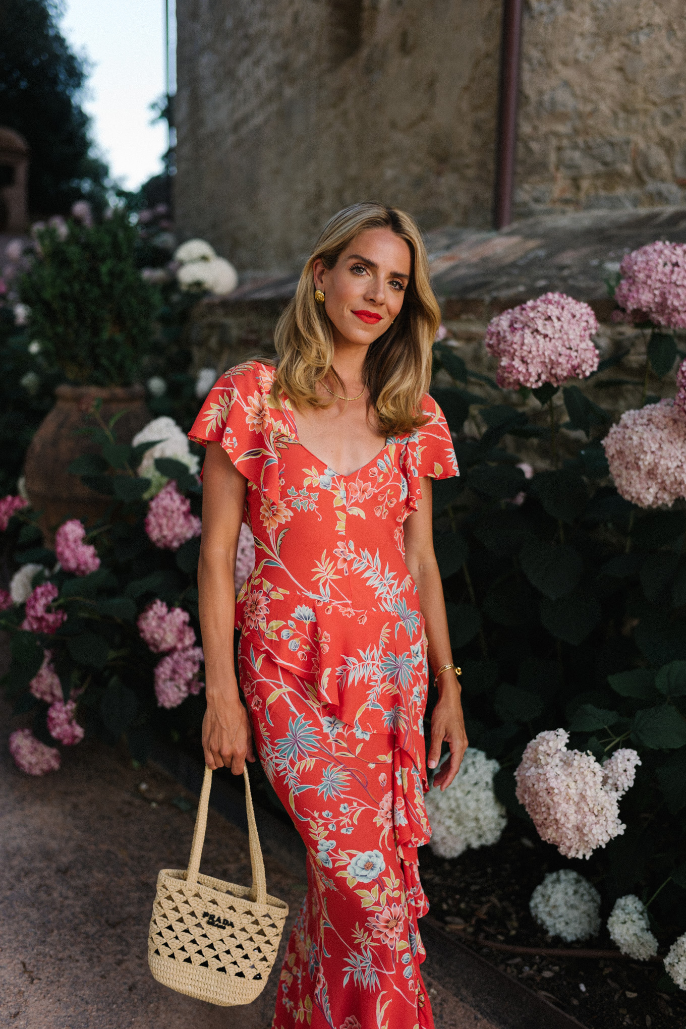 red floral midi dress straw bag