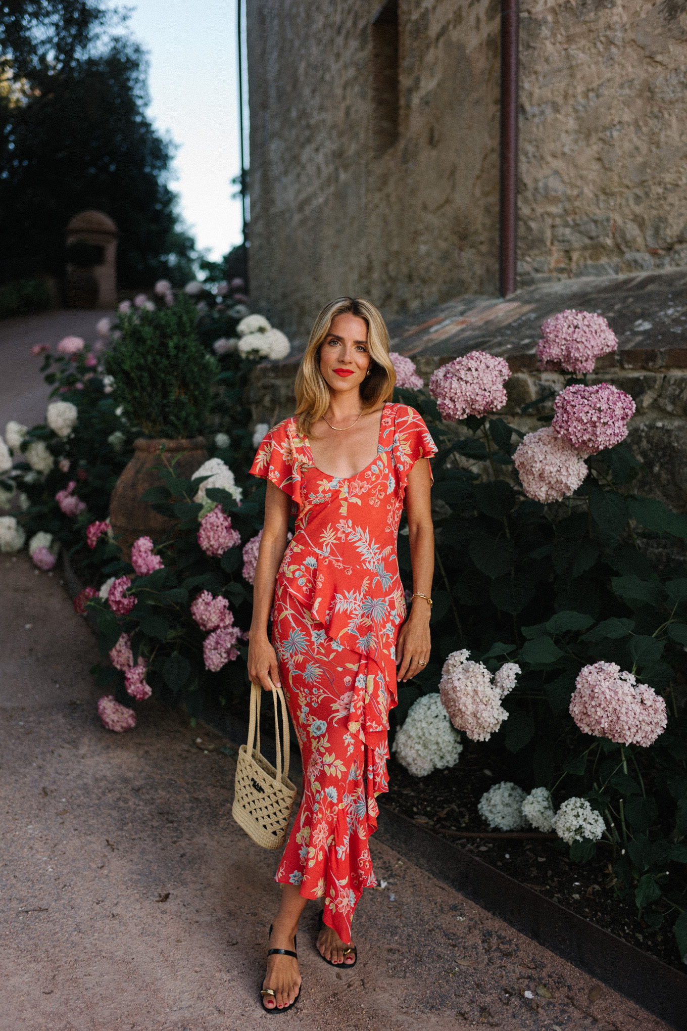 red floral midi dress straw bag