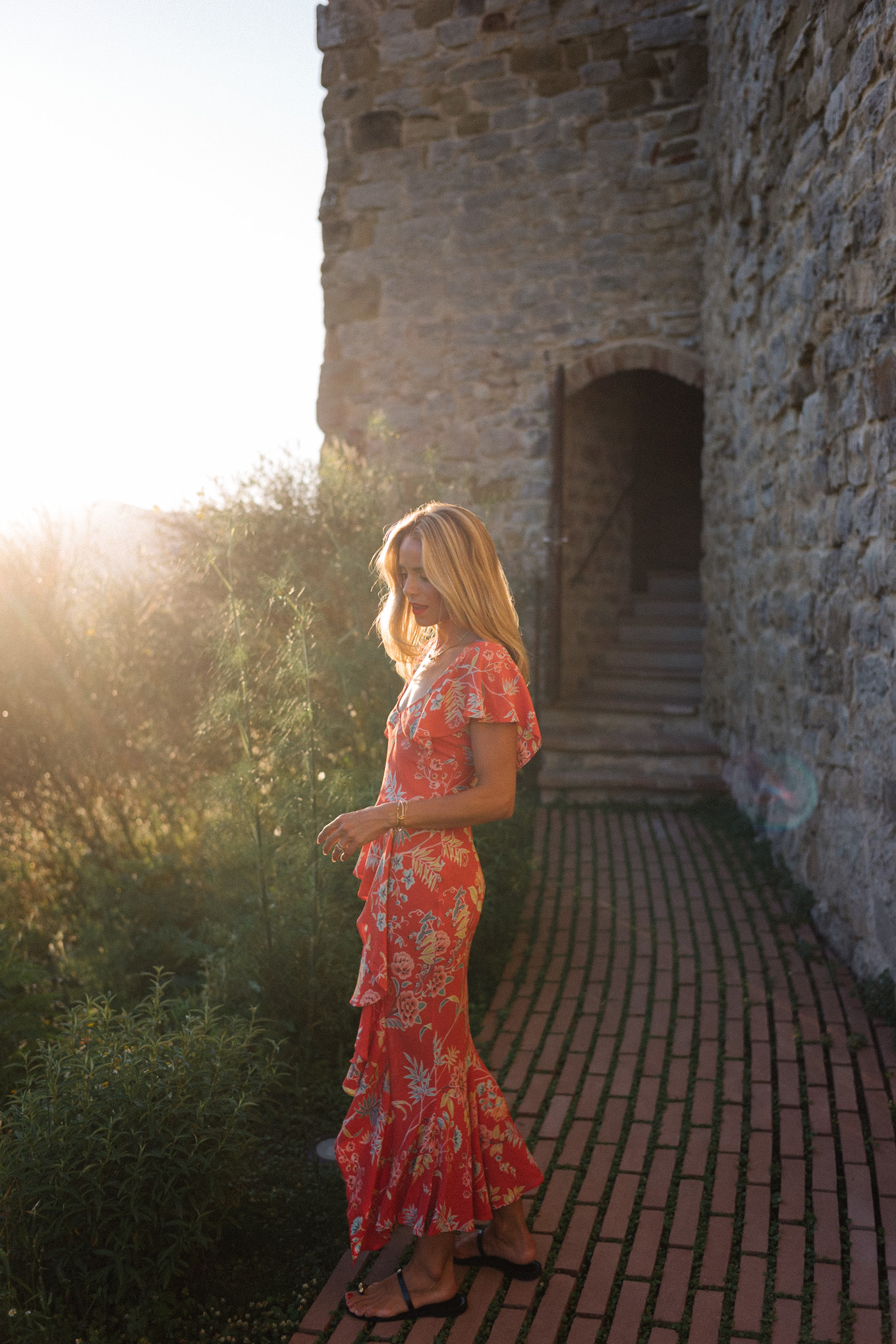 red floral midi dress straw bag