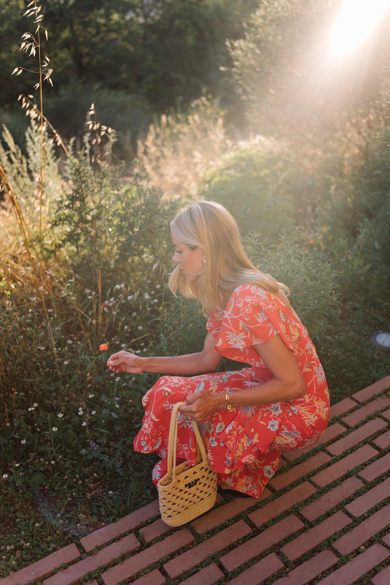 red floral midi dress straw bag