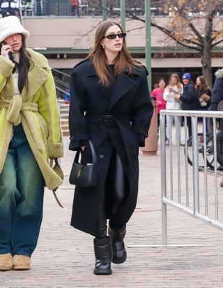 Hailey Bieber wearing a Saint Laurent maxi coat in Aspen