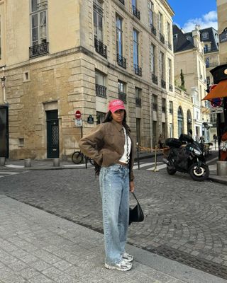 Woman wearing chunky sneakers in Paris.