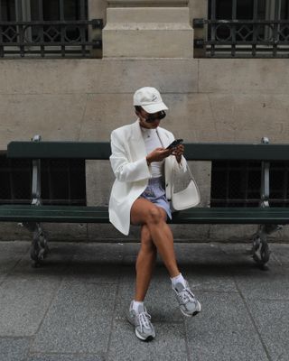 Woman wearing chunky sneakers in Paris.