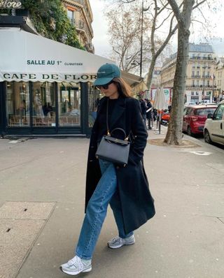 Woman wearing chunky sneakers in Paris.