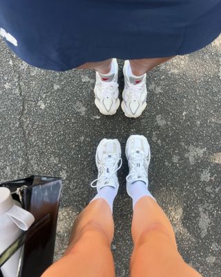 Woman wearing chunky sneakers in Paris.