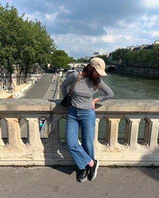 Woman wearing chunky sneakers in Paris.