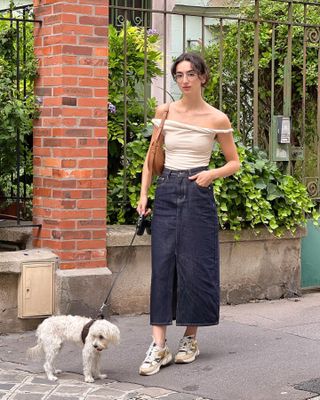 Woman wearing chunky sneakers in Paris.