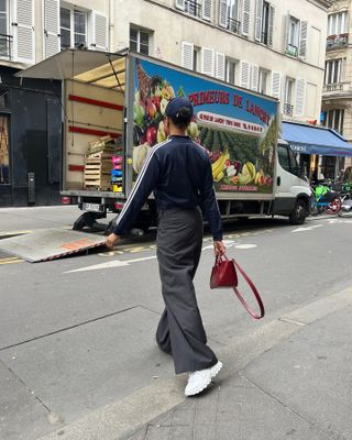 Woman wearing chunky sneakers in Paris.