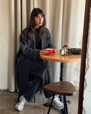 Woman wearing chunky sneakers in Paris.