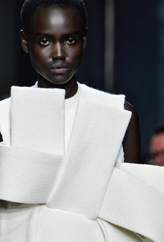 a model on the JW Anderson spring 2025 runway wearing the surreal knitwear trend