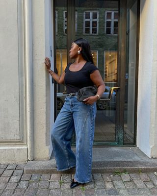 Nnenna wearing jeans and pointed toe shoes