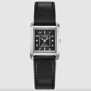 a watch with a black leather strap and silver hardware