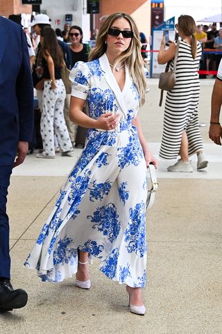 Sydney Sweeney wearing a blue floral dress