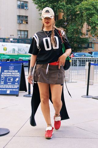 Rihanna wearing red sneakers