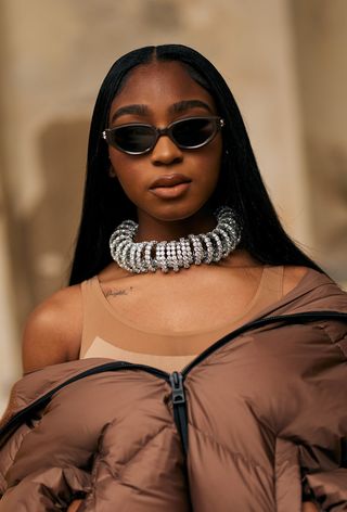 Normani wearing oversize jewelry during Milan Fashion Week spring/summer 2025.