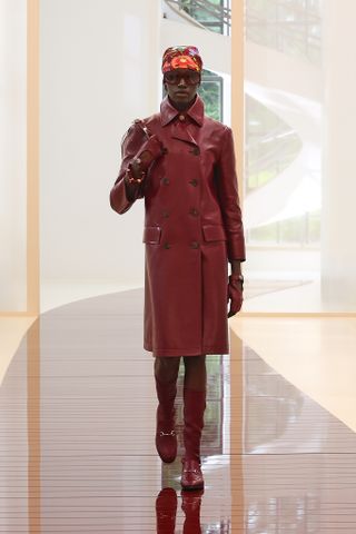 Gucci Spring 2025 models walk the runway in oxblood looks