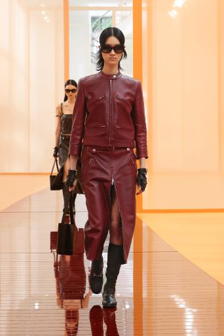 Gucci Spring 2025 models walk the runway in oxblood looks