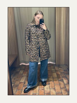 Woman wears leopard-print straight-fit coat