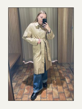 Woman wears cotton trench coat