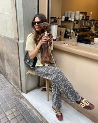 Fashion influencer Luna Isabella wearing an on-trend fall outfit featuring animal print.