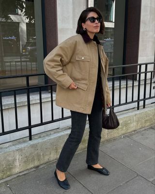 Fashion influencer Lucy Alston wearing an on-trend fall outfit featuring a barn coat.