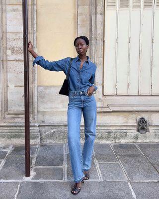 Fashion influencer Sylive Mus wearing an on-trend fall outfit featuring double denim.