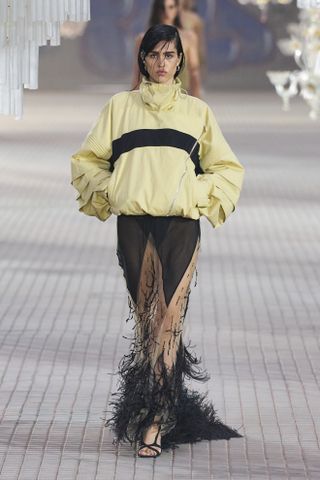 a model walks the runway during Milan Fashion Week spring/summer 2025