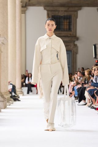 a model walks the spring 2025 runway during Milan Fashion Week