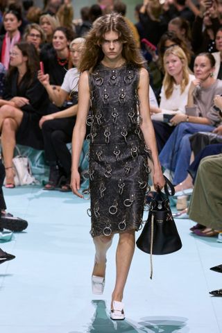 a model walks the Prada spring 2025 runway