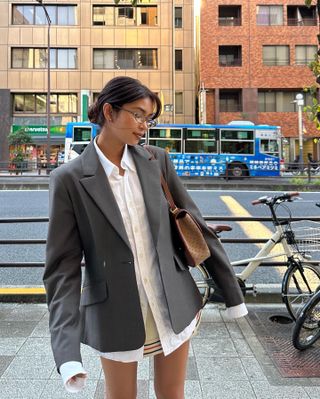 Content creator Mishti Rahman wears a Gucci blazer while visiting Tokyo, Japan