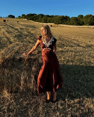 Lucia Cuesta wearing a burgundy Doen dress