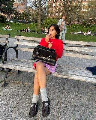 Fashion influencer and stylist Michelle Li wearing chic fall footwear with socks.